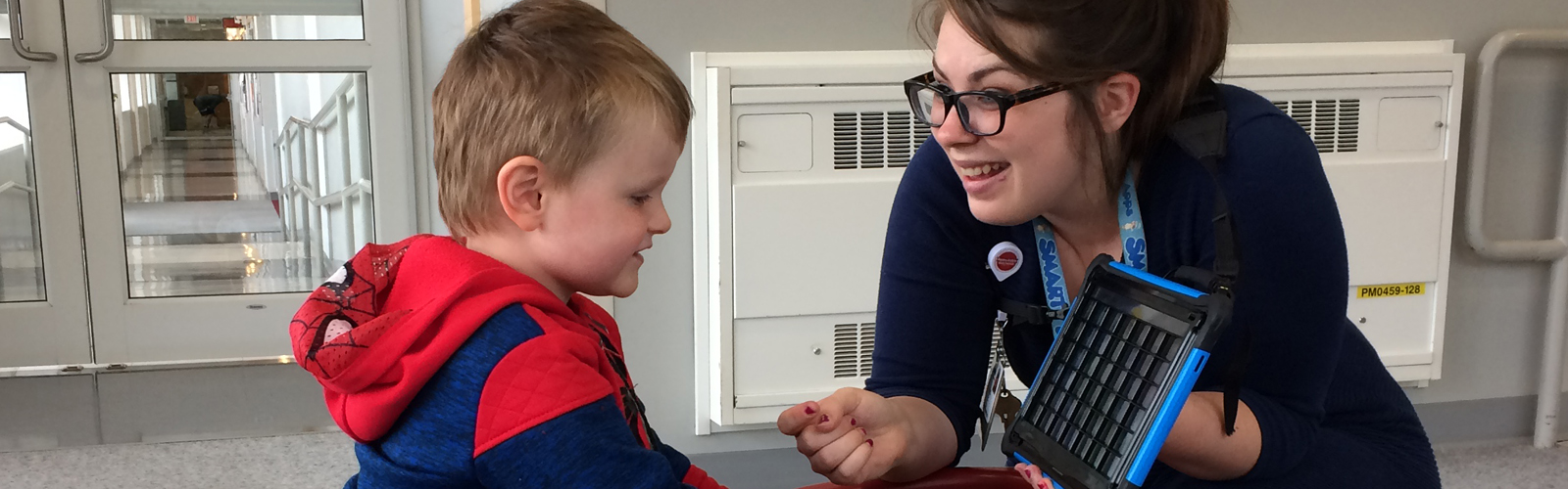 Image of child and instructor interacting