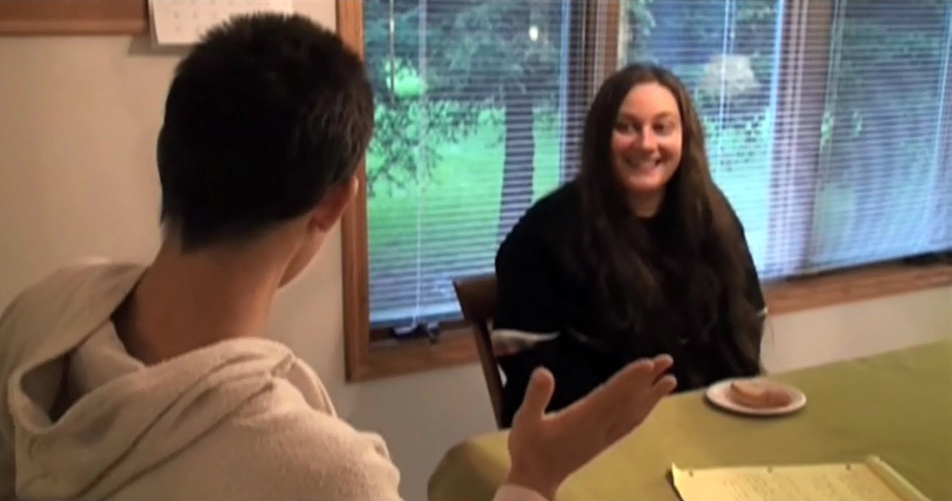 Image of two people talking