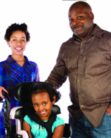 mom, dad and daughte in wheelchair page 28