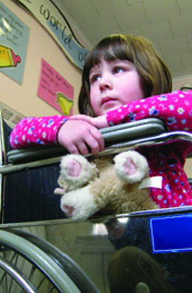 young girl in wheelchair