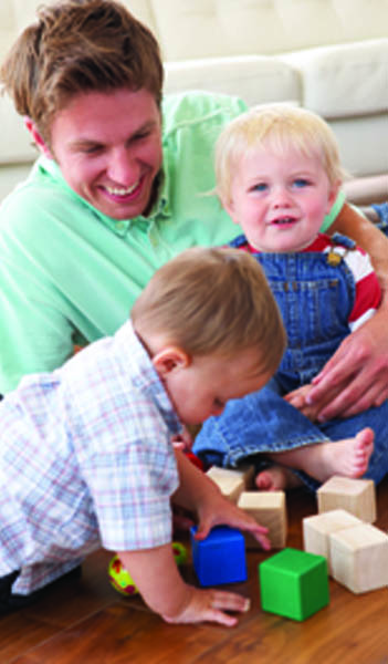 Dad with his two sonss laughing. Page 12