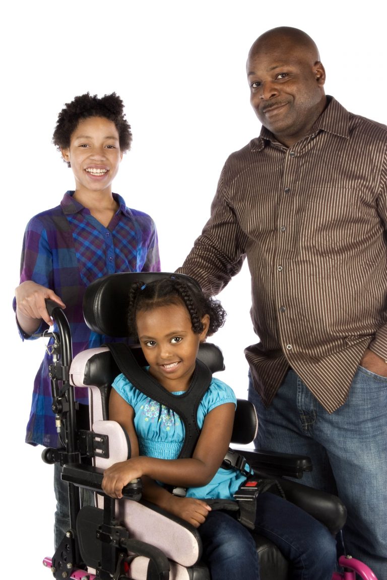 Mom, Dad and daughter is in a wheelchair.